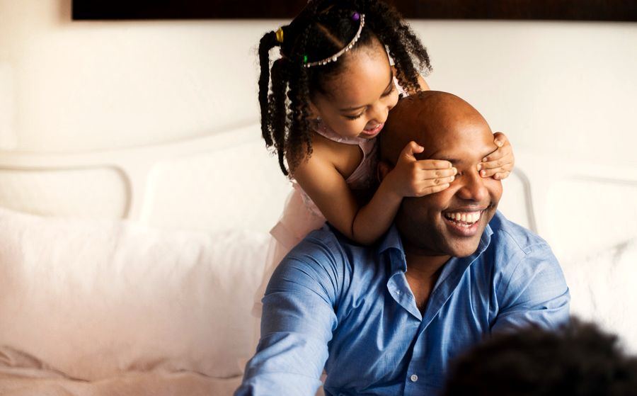 A parent and child together at home